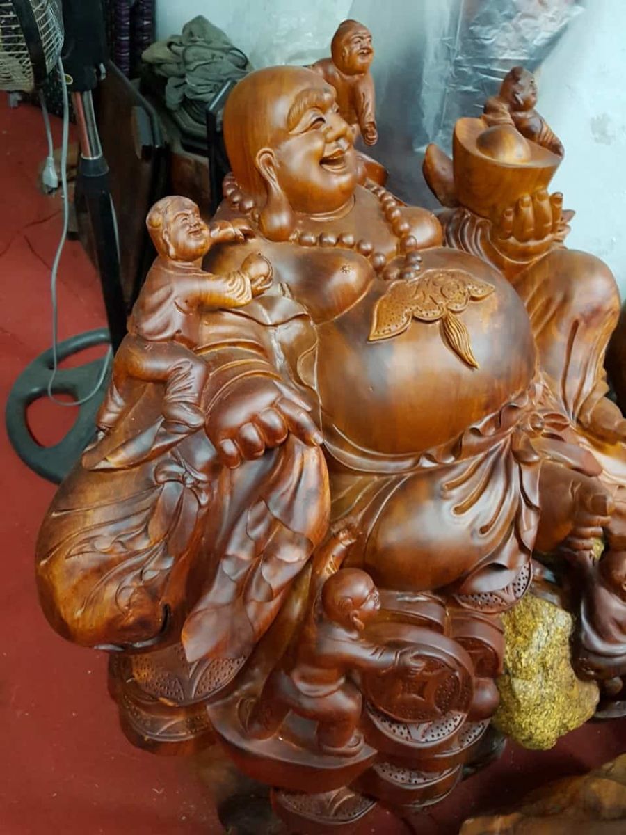 Tượng Di Lặc ngồi ngũ phúc gỗ hương ôm đá